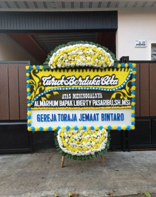 Papan Bunga Duka di Skanto
